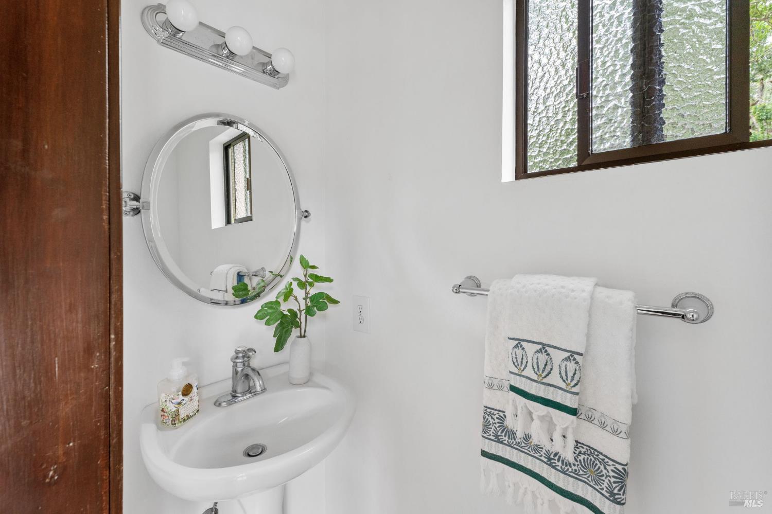 2231 First Avenue Napa, CA 94558 - Photo 22 of 64 a bathroom with a sink and a mirror
