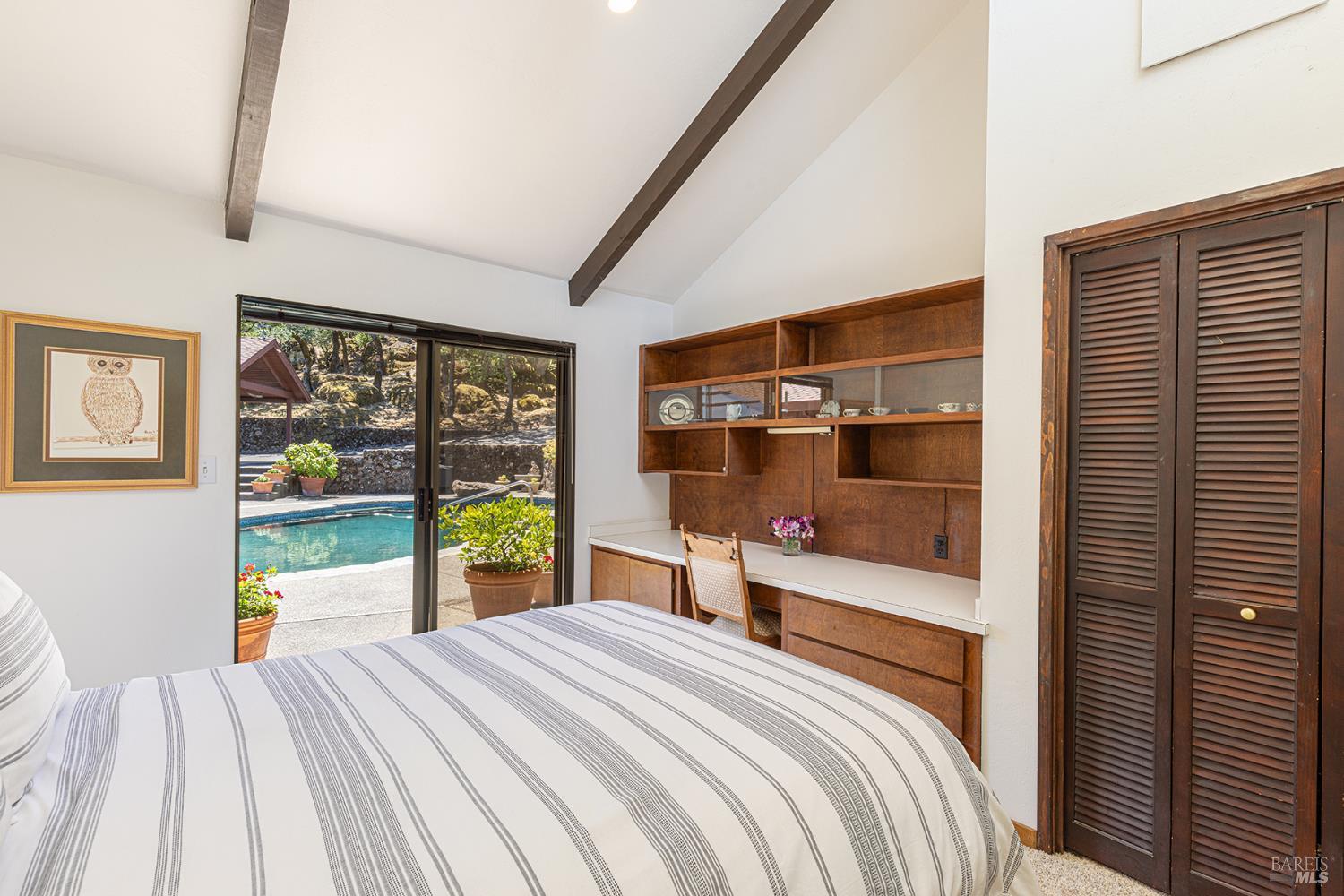2231 First Avenue Napa, CA 94558 - Photo 23 of 64 a bedroom with a bed and large window