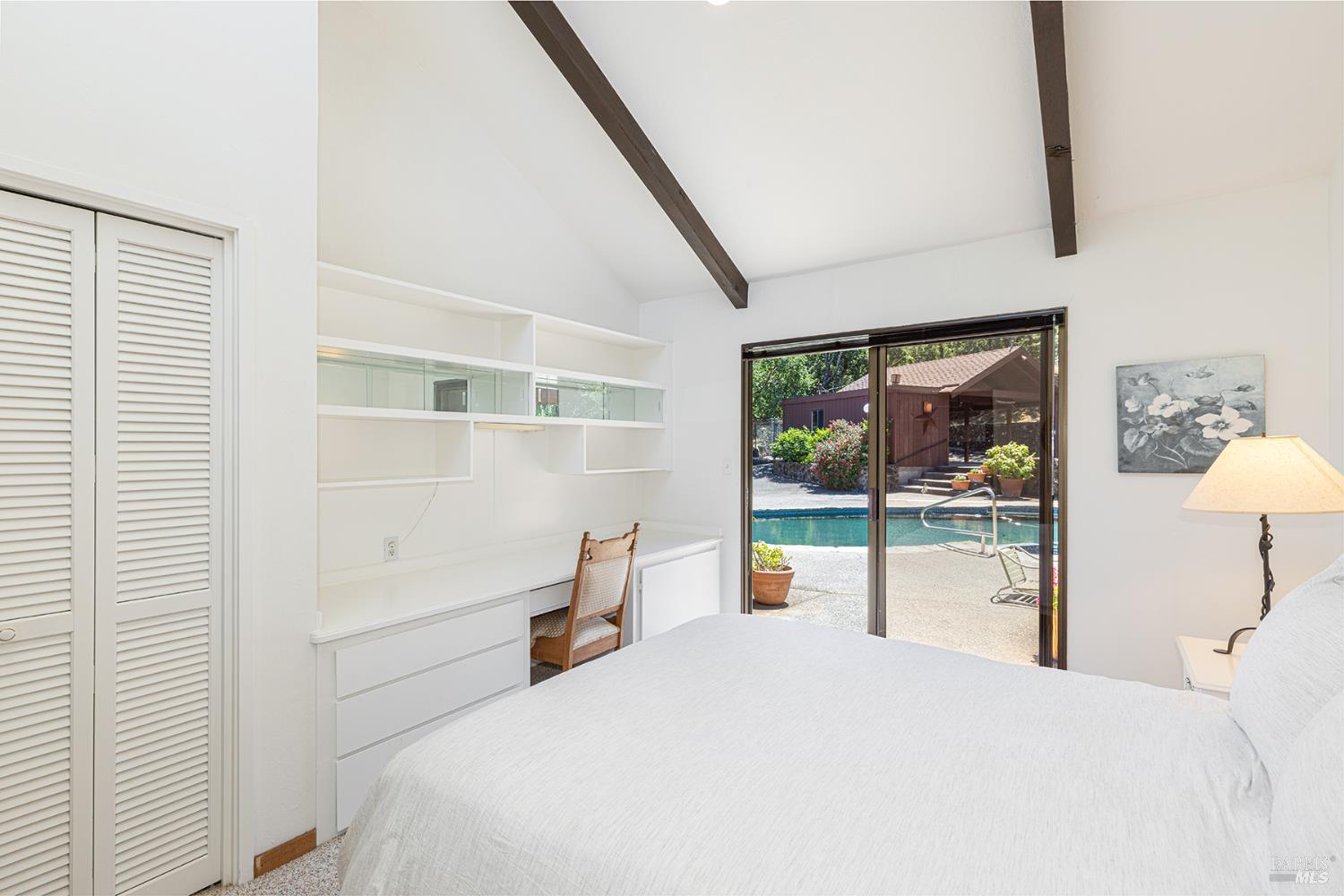 2231 First Avenue Napa, CA 94558 - Photo 31 of 64 a bedroom with a bed and a large window