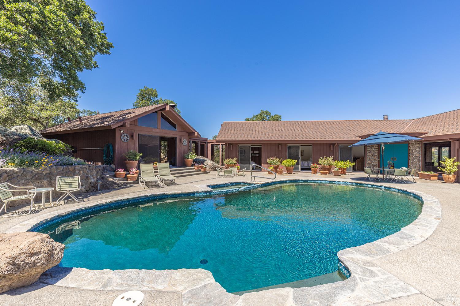 2231 First Avenue Napa, CA 94558 - Photo 4 of 64 a front view of house with swimming pool yard and outdoor seating