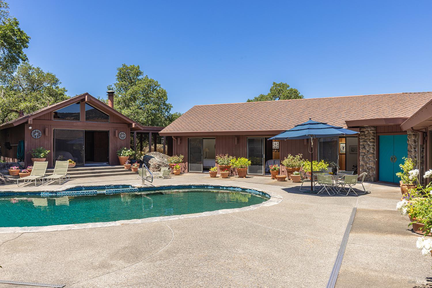 2231 First Avenue Napa, CA 94558 - Photo 5 of 64 a front view of a house with sitting area and garden