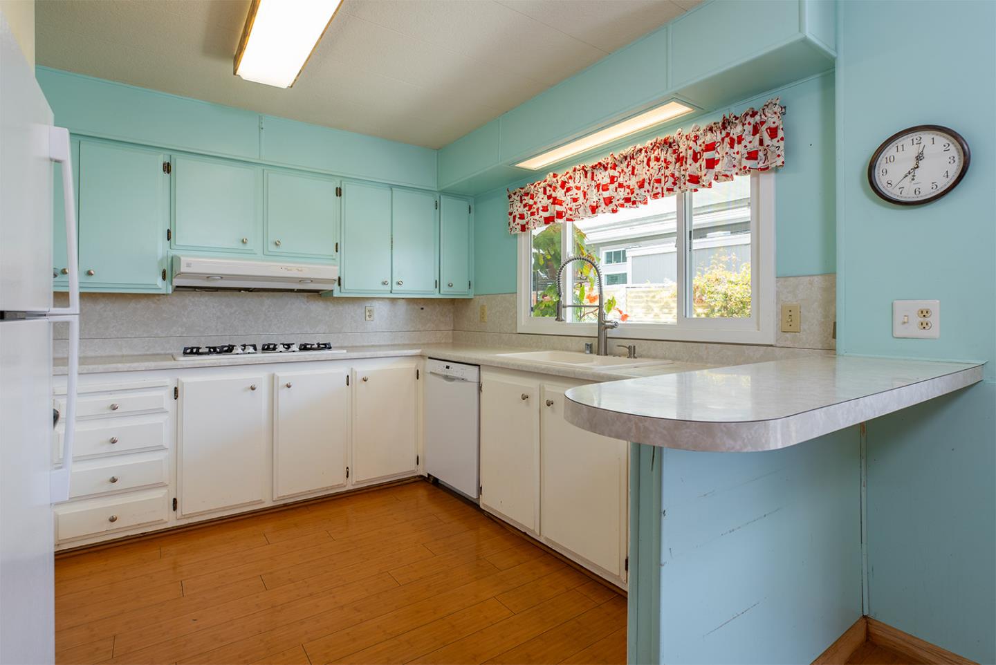 7 Oak Shadows Lane Aptos, CA 95003 - Photo 16 of 36 a kitchen with granite countertop a sink window and cabinets