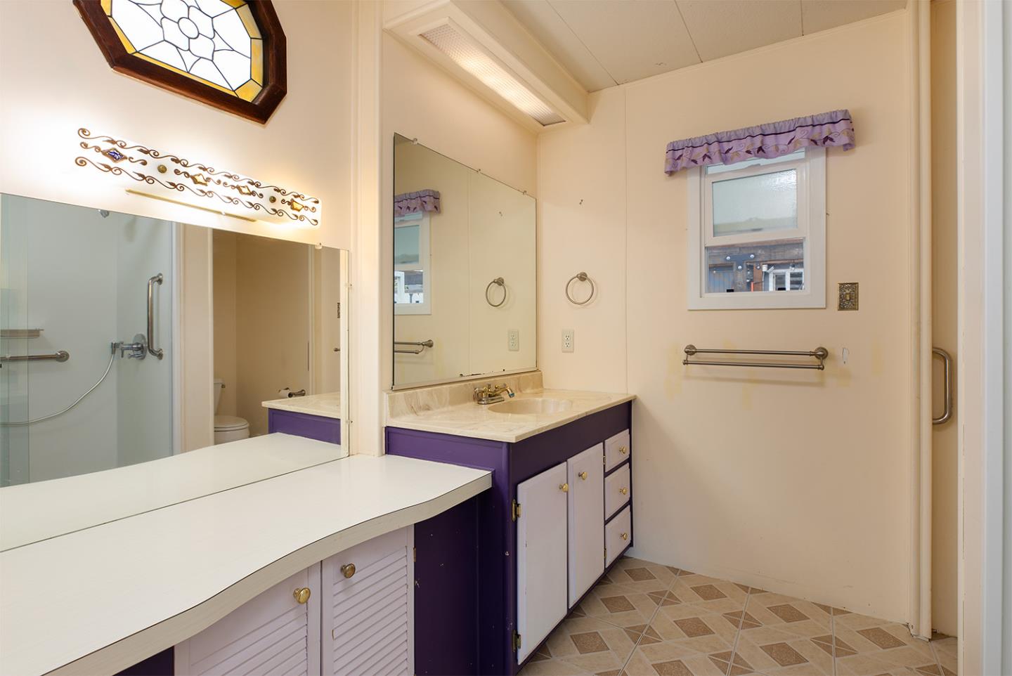 7 Oak Shadows Lane Aptos, CA 95003 - Photo 22 of 36 a bathroom with a sink and a mirror
