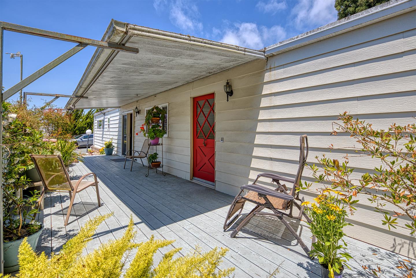 7 Oak Shadows Lane Aptos, CA 95003 - Photo 7 of 36 a view of a patio with table and chairs with wooden floor and fence