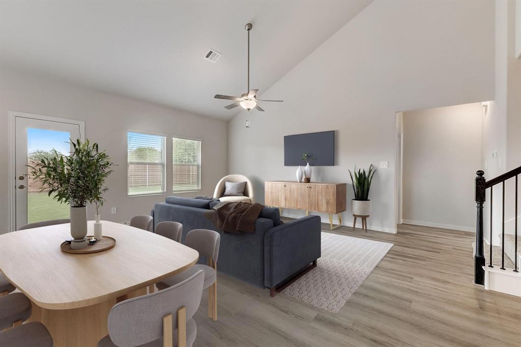 1405 Winters Way McKinney, TX 75071 - Photo 12 of 32 Living room with ceiling fan, high vaulted ceiling, and light hardwood / wood-style flooring