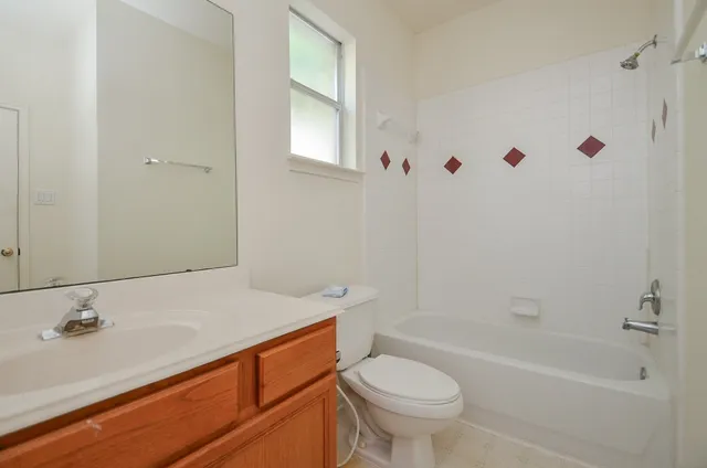 a bathroom with a sink a toilet and a bathtub