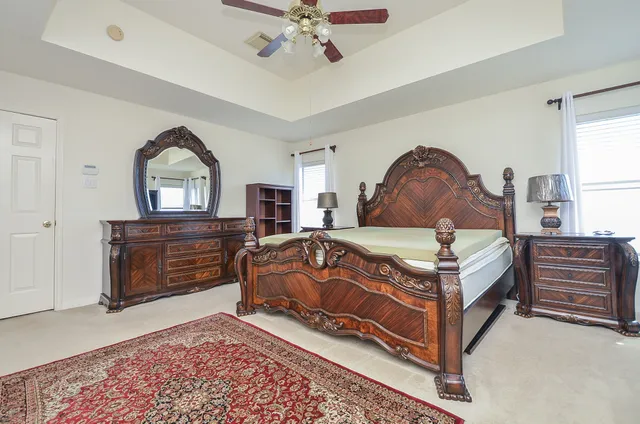 a bedroom with a bed and a dresser