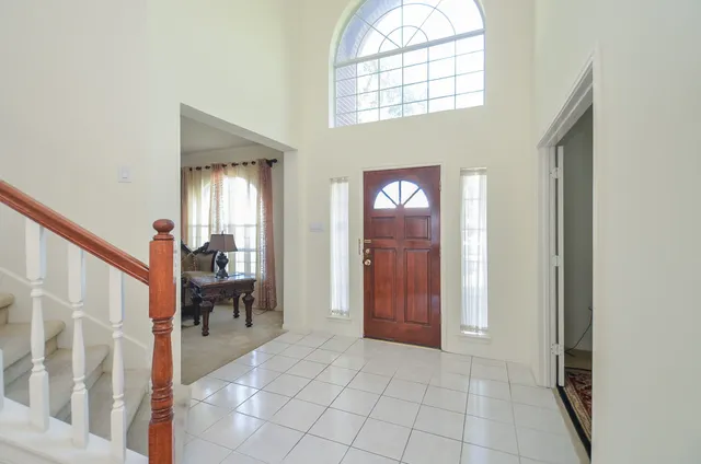 an entryway with a livingroom and outdoor seating