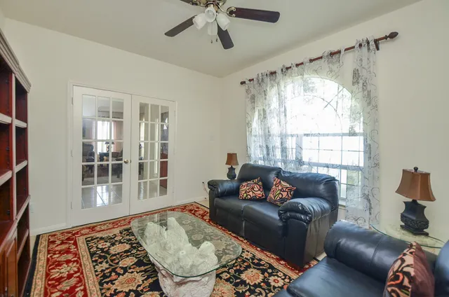 a living room with furniture and a window
