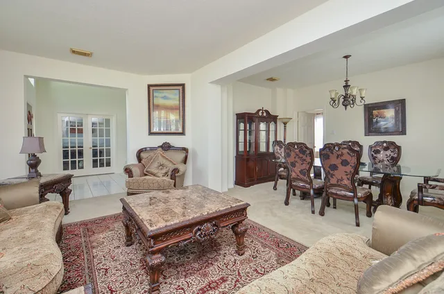 a living room with furniture rug and window