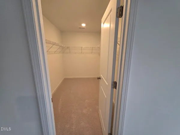 a bathroom with double vanity sink and a mirror