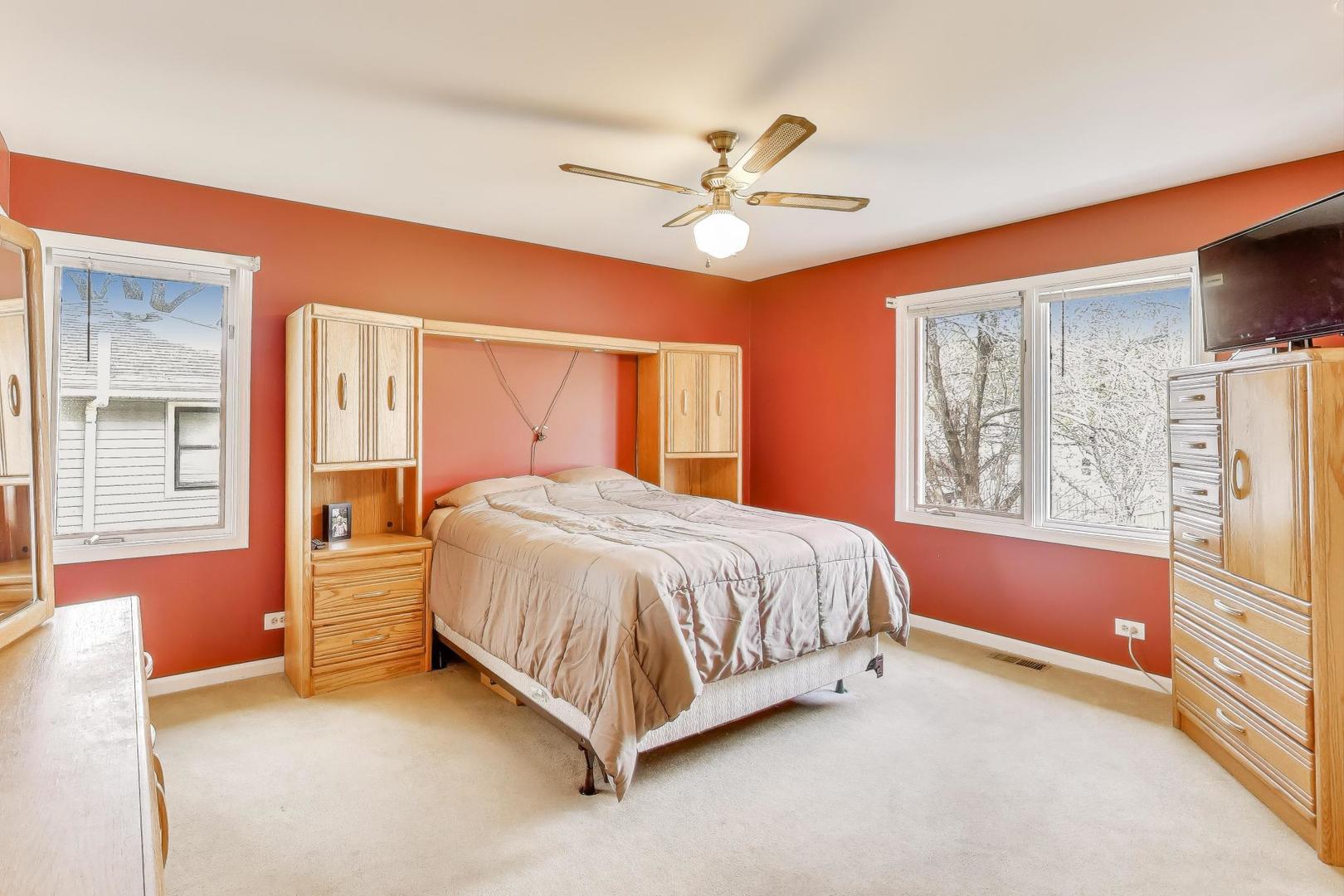 1407 Wilson Avenue Wheaton, IL 60189 - Photo 11 of 31 a spacious bedroom with a bed and wooden floor