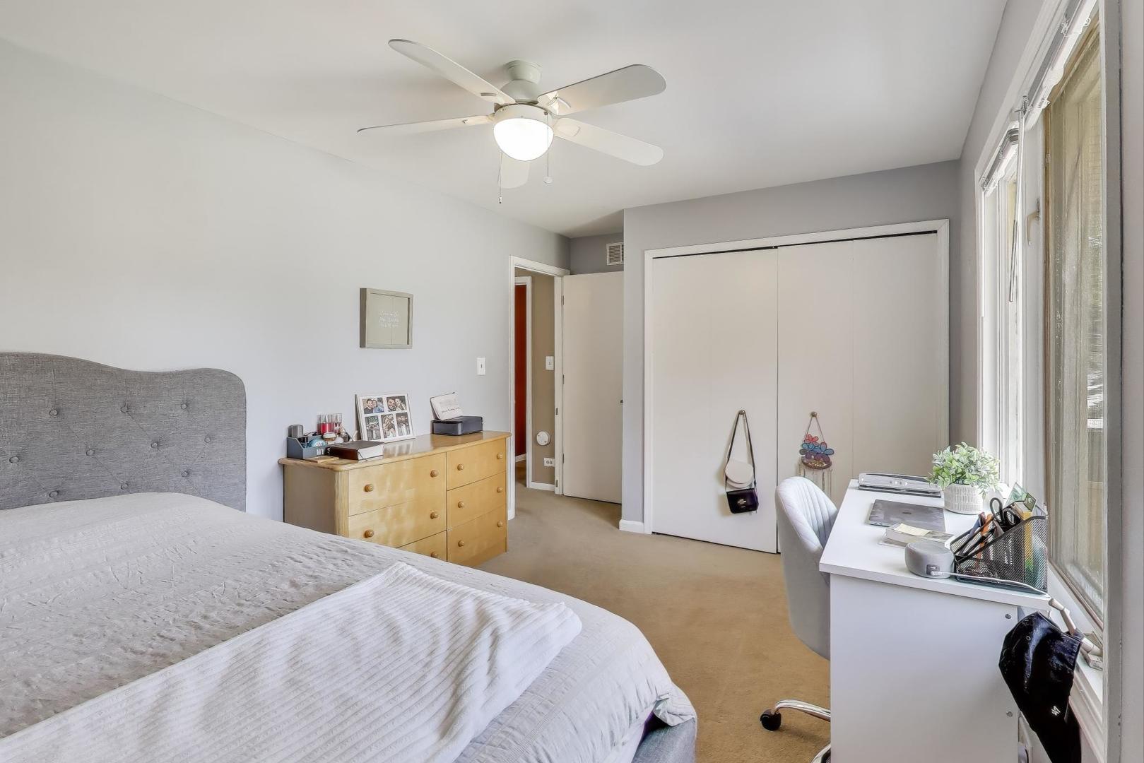 1407 Wilson Avenue Wheaton, IL 60189 - Photo 14 of 31 a bedroom with a bed and a chandelier