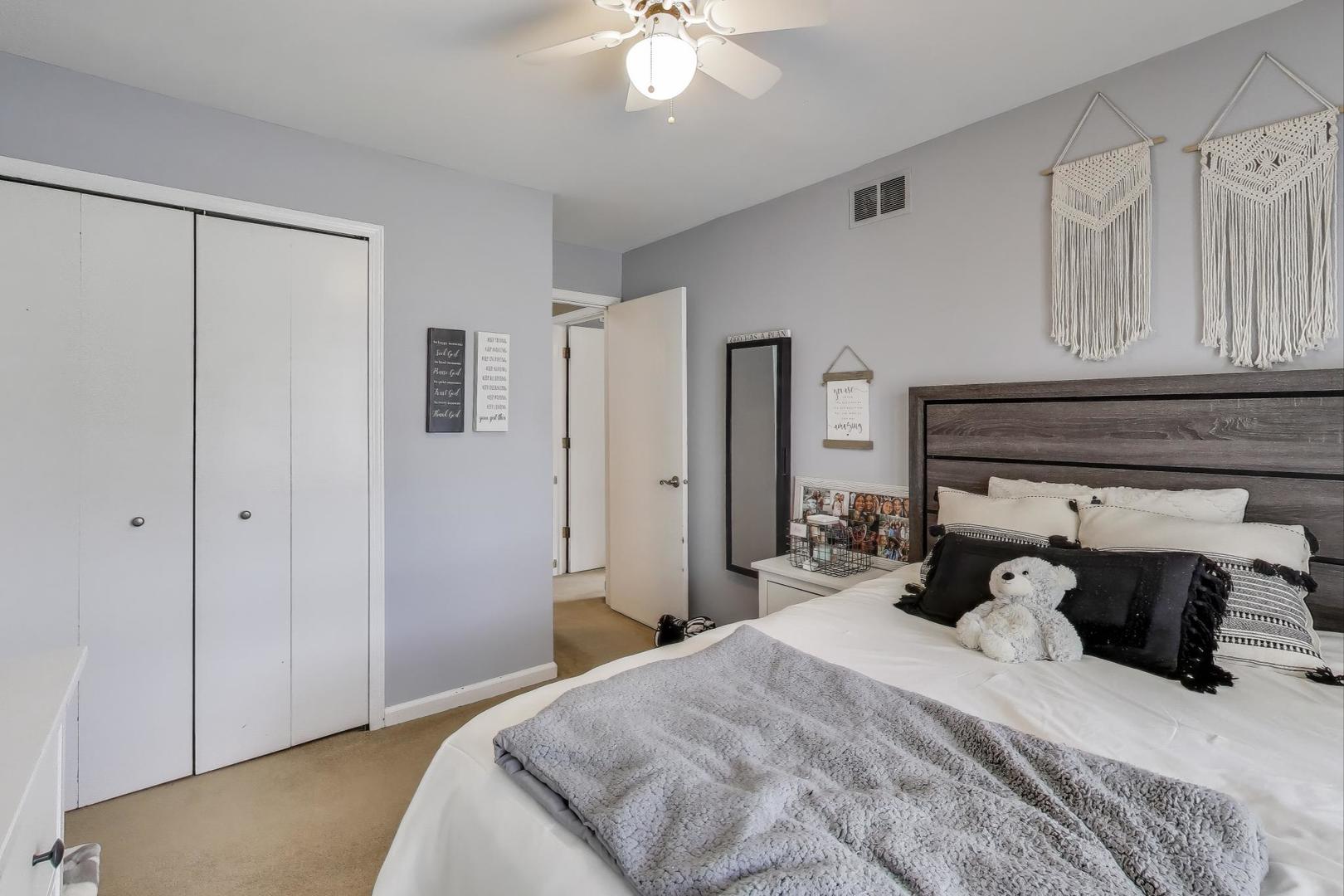 1407 Wilson Avenue Wheaton, IL 60189 - Photo 17 of 31 a bedroom with a bed and a chandelier