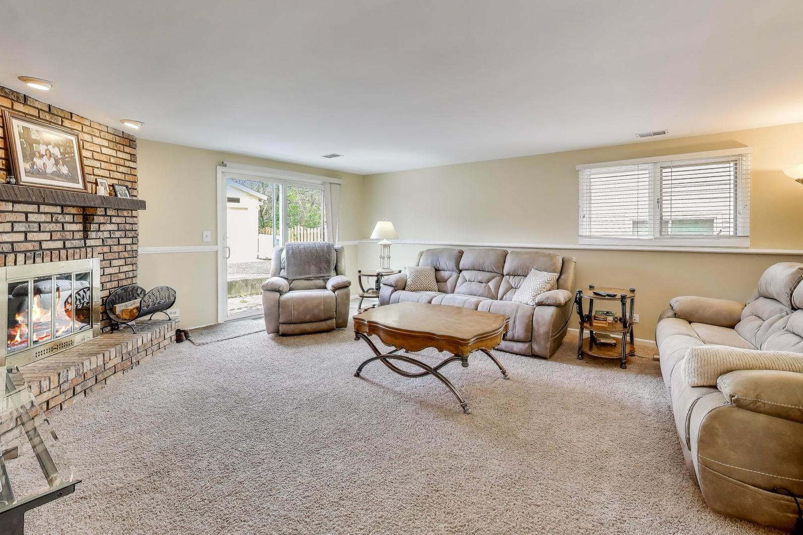 1407 Wilson Avenue Wheaton, IL 60189 - Photo 19 of 31 a living room with furniture and a large window