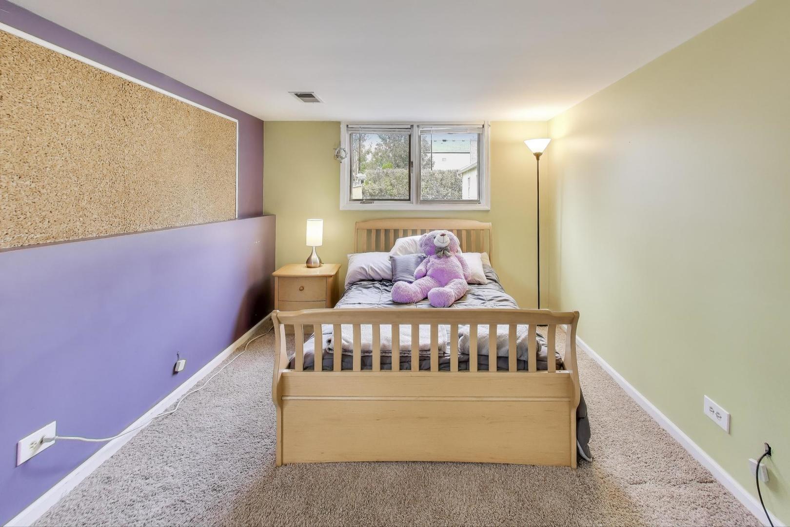 1407 Wilson Avenue Wheaton, IL 60189 - Photo 22 of 31 a bedroom with a bed and window
