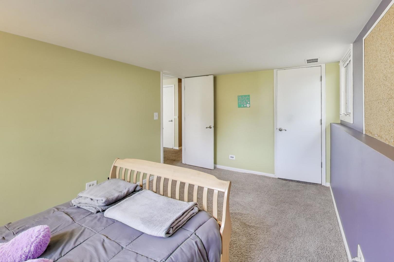1407 Wilson Avenue Wheaton, IL 60189 - Photo 23 of 31 a view of a bedroom with wooden floor
