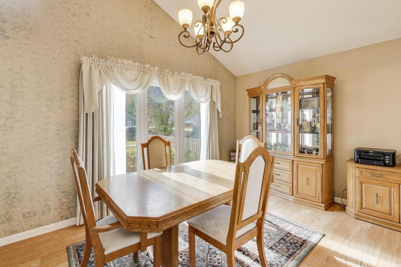 1407 Wilson Avenue Wheaton, IL 60189 - Photo 4 of 31 a view of a dining room with furniture window and outside view