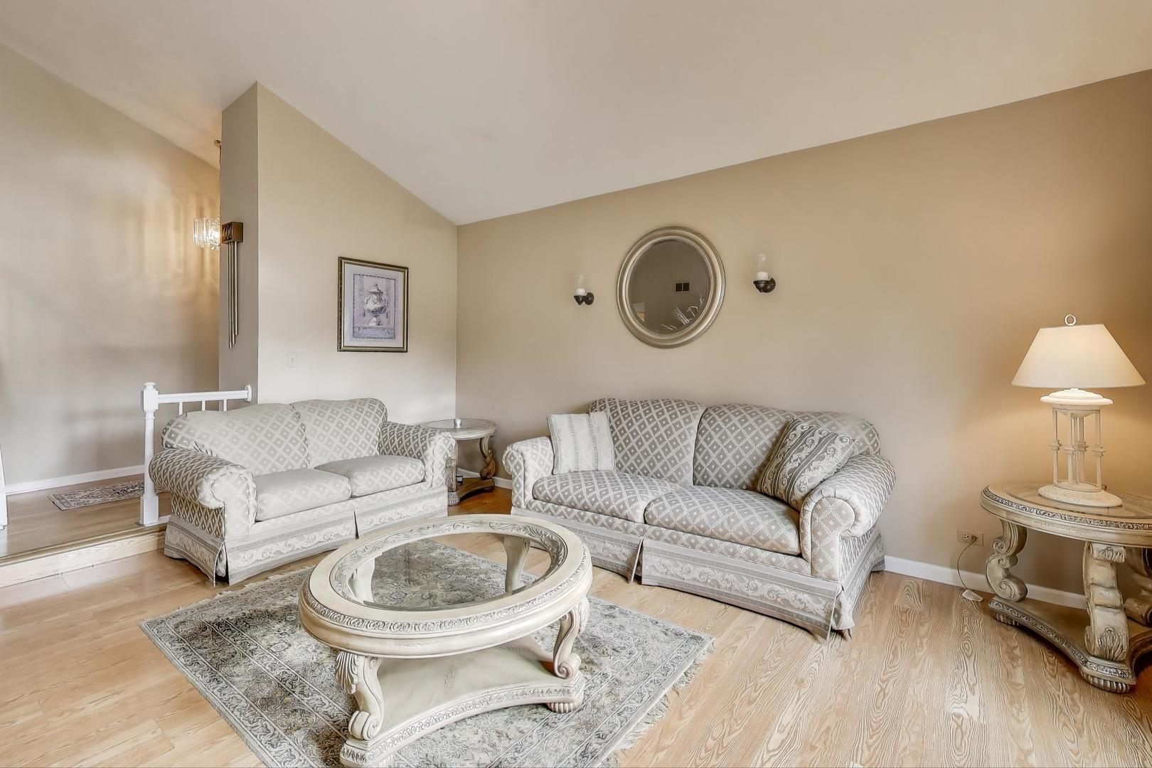 1407 Wilson Avenue Wheaton, IL 60189 - Photo 8 of 31 a living room with furniture a couch and a lamp