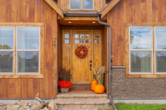a backyard of a house with potted plants