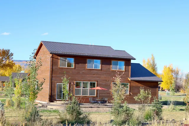 a kitchen with stainless steel appliances granite countertop a lot of counter space
