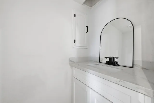 a close view of a sink and a vanity in a bathroom