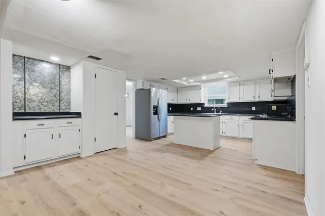 a view of kitchen with wooden floor
