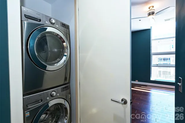 a view of a storage and utility room with a washer dryer
