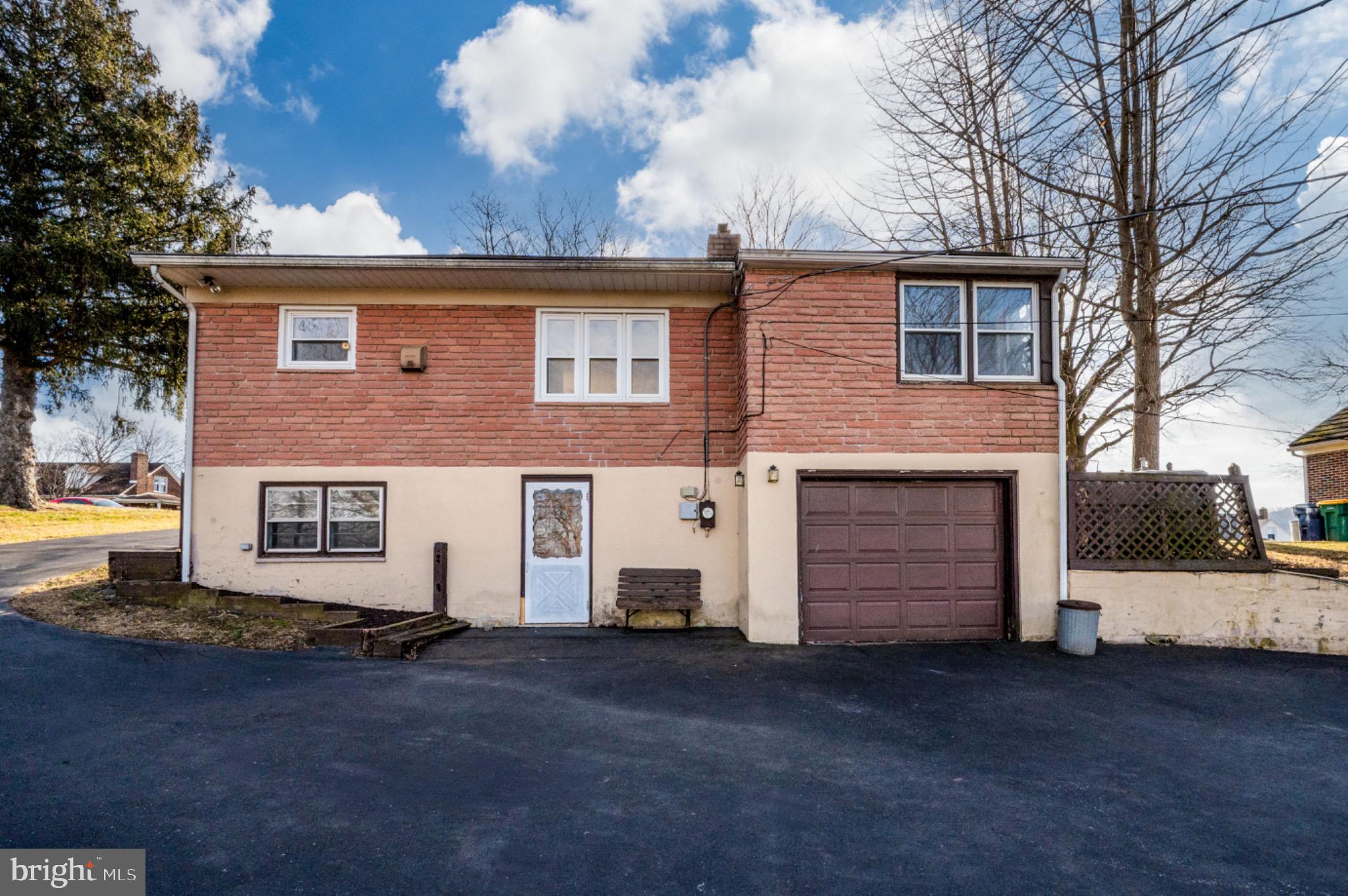 3029 Grandview Boulevard Reading, PA 19608 - Photo 40 of 41 a view of a white house with a yard and garage
