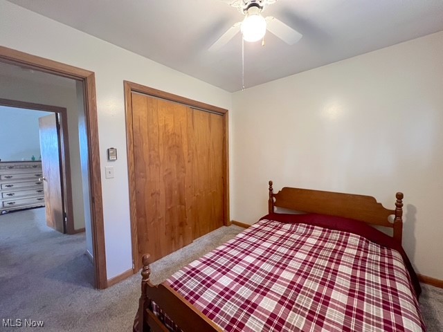 6852 Riverside Road Southeast Uhrichsville, OH 44683 - Photo 16 of 30 Bedroom featuring carpet flooring, a closet, and ceiling fan
