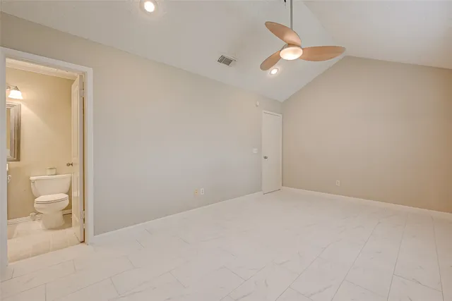 a view of an empty room and glass door