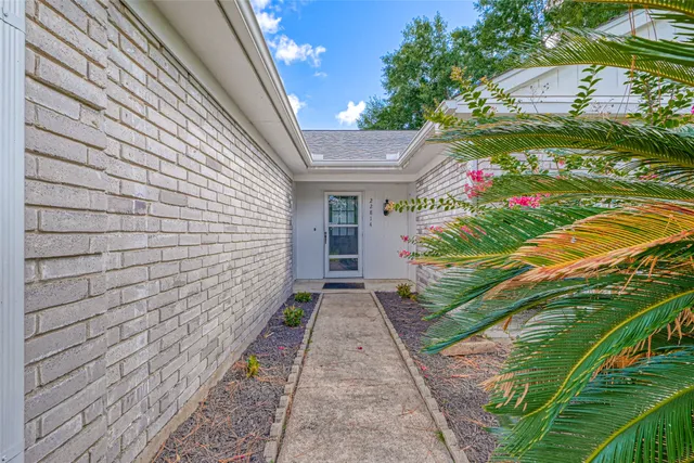 a view of house with backyard