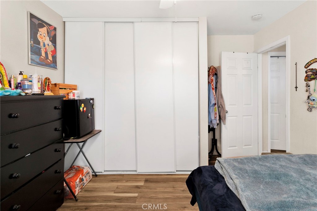 18350 Jonathan Street Adelanto, CA 92301 - Photo 21 of 32 a bedroom with a bed and a dresser