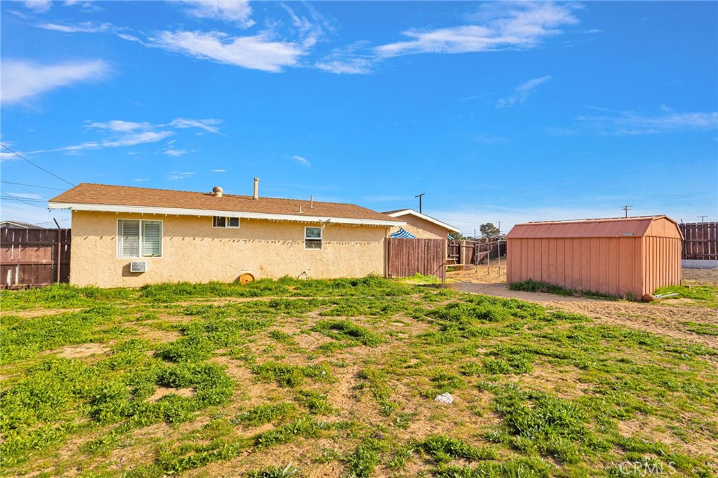 18350 Jonathan Street Adelanto, CA 92301 - Photo 26 of 32 a view of a house with a yard