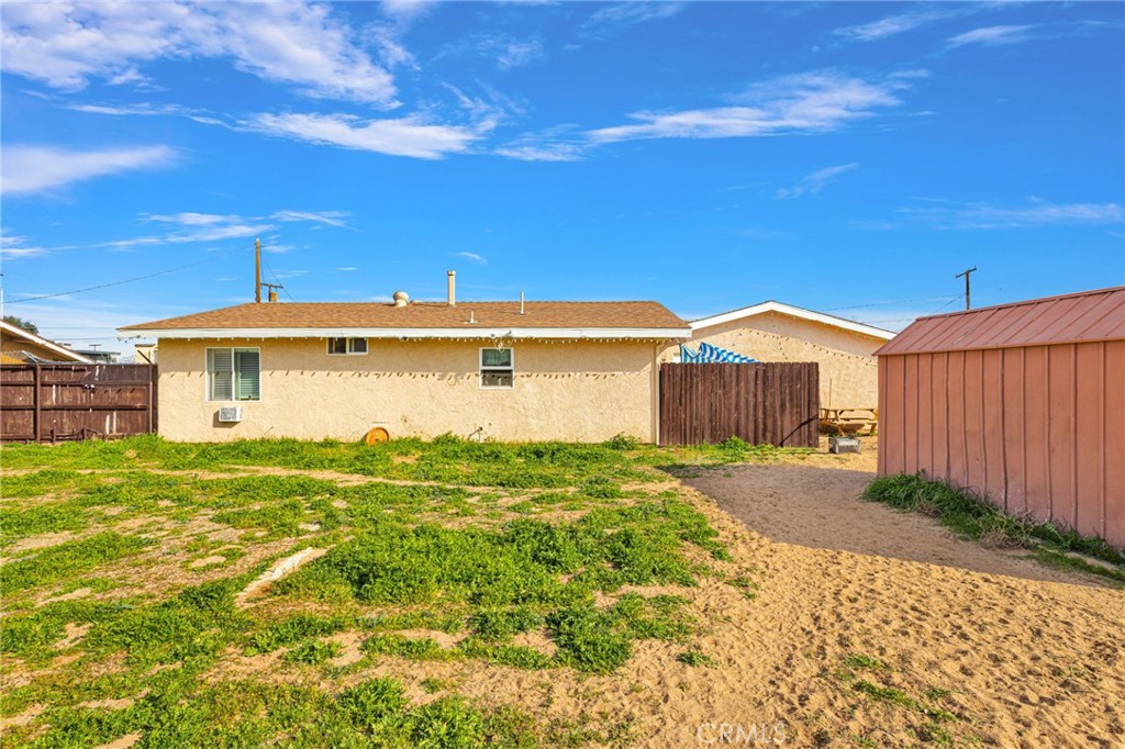 18350 Jonathan Street Adelanto, CA 92301 - Photo 27 of 32 a view of a backyard of the house