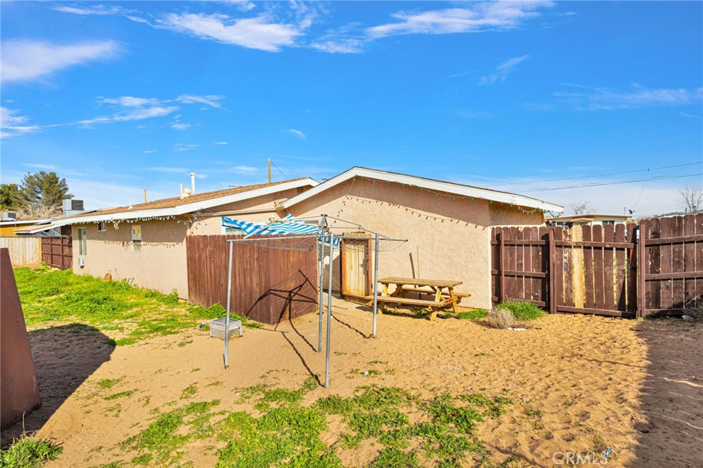 18350 Jonathan Street Adelanto, CA 92301 - Photo 30 of 32 a view of a backyard of a house