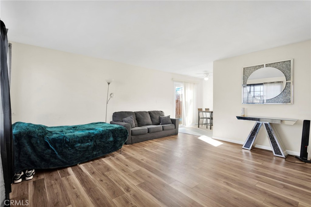 18350 Jonathan Street Adelanto, CA 92301 - Photo 6 of 32 a living room with furniture and a wooden floor