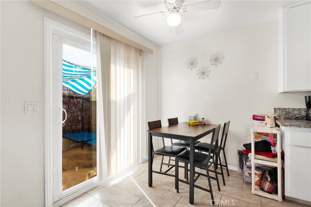 18350 Jonathan Street Adelanto, CA 92301 - Photo 10 of 32 a view of a dining room with furniture and a window