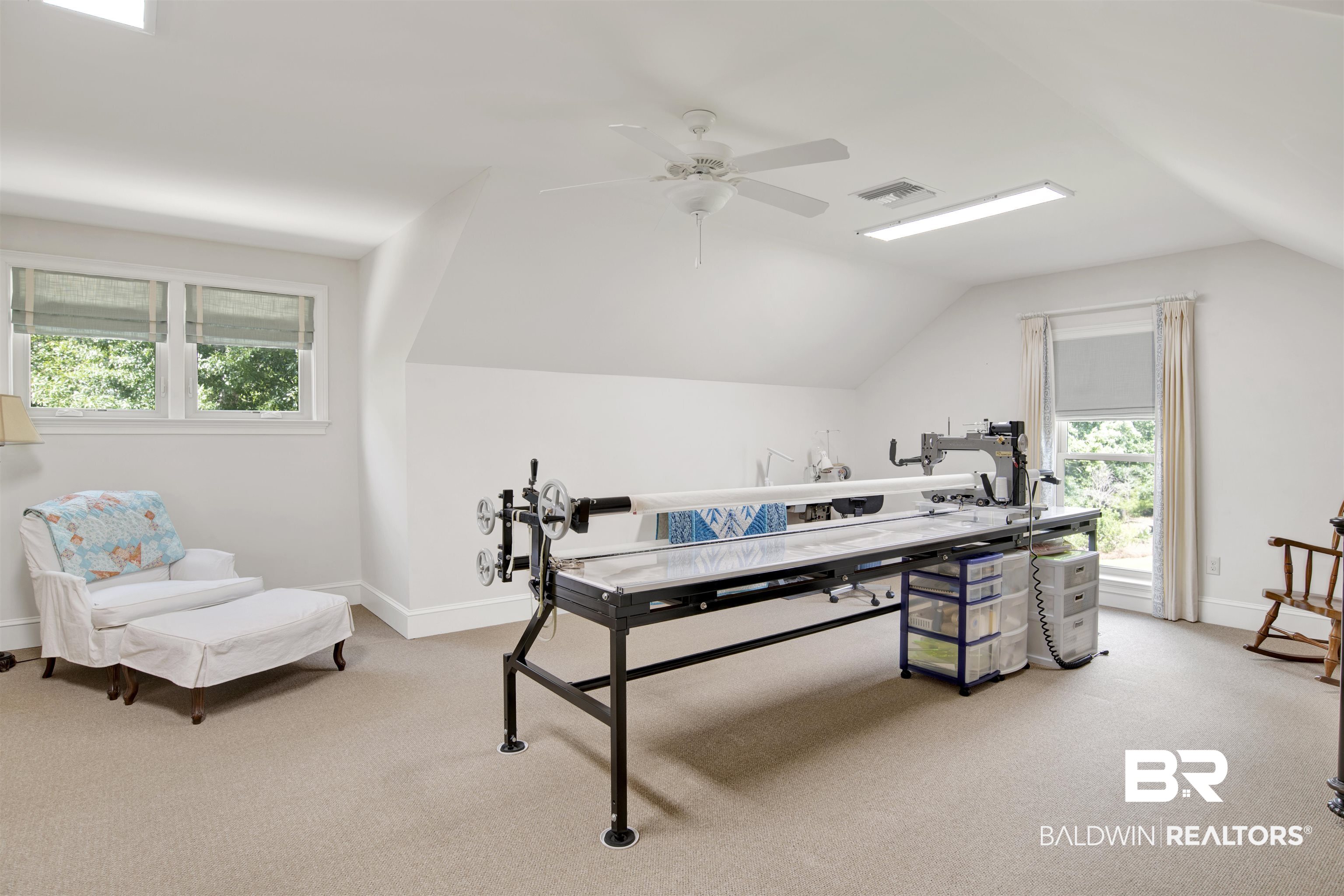 8358 Forest Lane Foley, AL 36535 - Photo 16 of 46 Office area featuring light colored carpet, vaulted ceiling, healthy amount of natural light, and ceiling fan