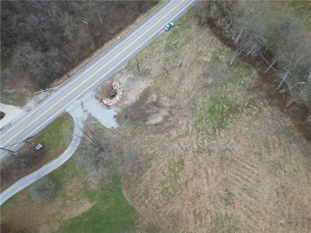 a view of a field with trees