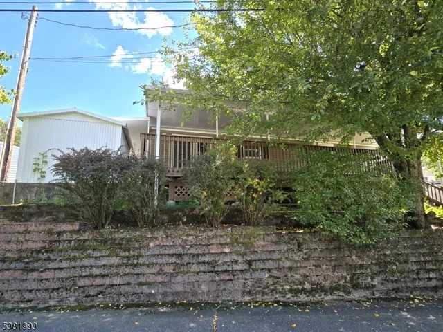 a view of a house with a yard and an outdoor space