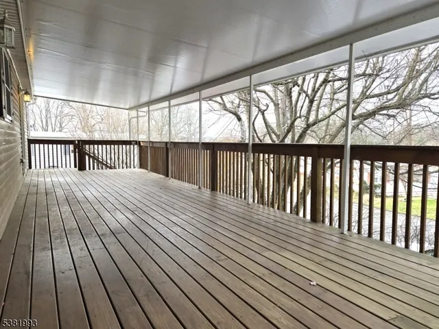 a balcony with wooden floor