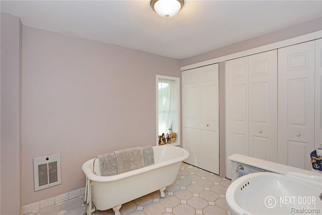 1426 Faussett Road Howell, MI 48855 - Photo 12 of 28 Extra large bathroom with claw foot bathtub and pedestal sink