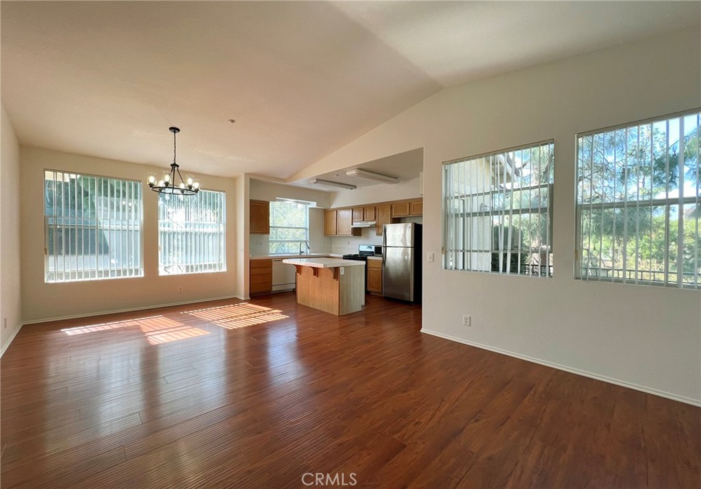 512 Birch Grove Irvine, CA 92618 - Photo 1 of 20 a view of a living room and kitchen with furniture wooden floor
