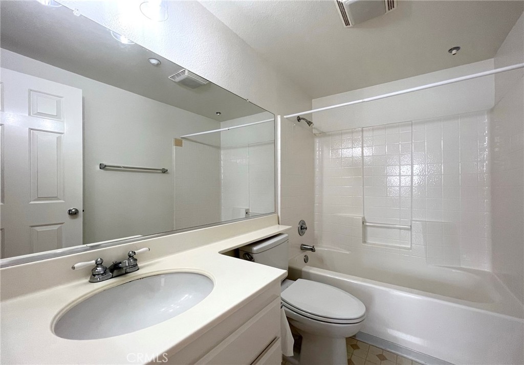 512 Birch Grove Irvine, CA 92618 - Photo 20 of 20 a bathroom with a sink toilet and shower