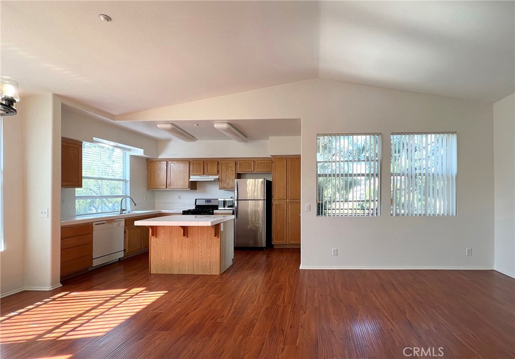 512 Birch Grove Irvine, CA 92618 - Photo 3 of 20 a kitchen with stainless steel appliances a stove top oven a sink dishwasher and a refrigerator