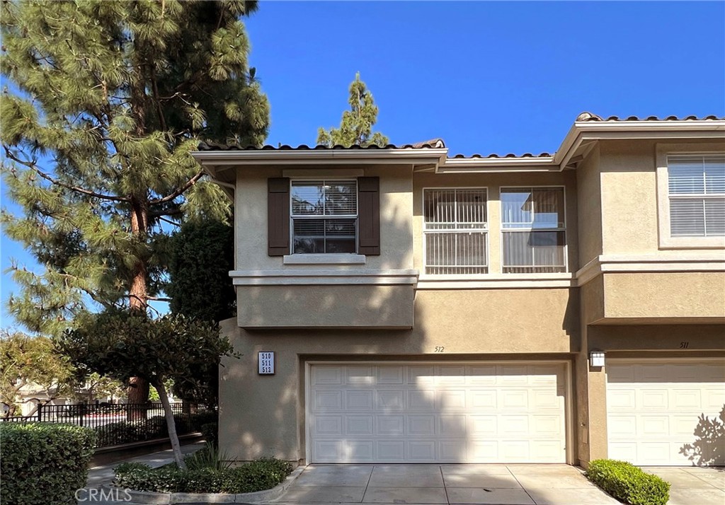 512 Birch Grove Irvine, CA 92618 - Photo 6 of 20 a front view of a house with a tree
