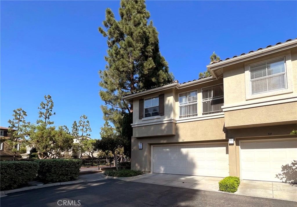 512 Birch Grove Irvine, CA 92618 - Photo 7 of 20 a front view of a house with a yard
