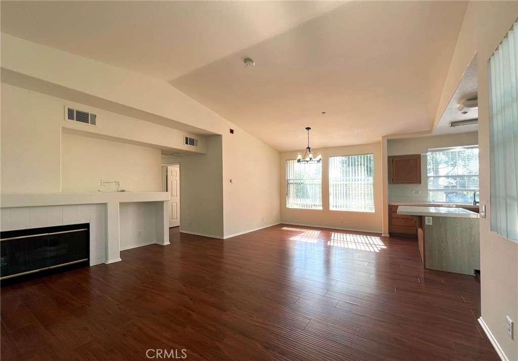 512 Birch Grove Irvine, CA 92618 - Photo 9 of 20 a view of an empty room with wooden floor and a window
