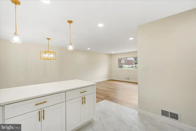 a kitchen with a sink and large window